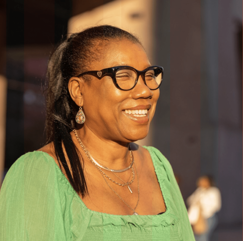 Woman smiling in the sunshine.