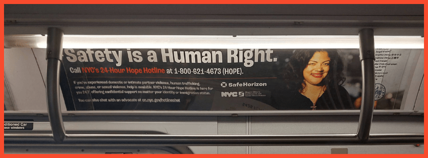 A photo of the Safety is a Human Right ad on a subway