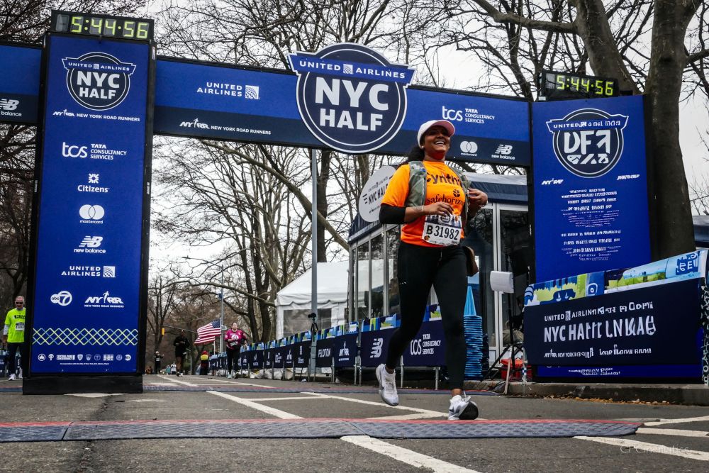 A runner at the finish line of the NYC Half Marathon.