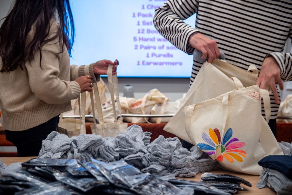 Supplies on a table being packed into kits for survivors.